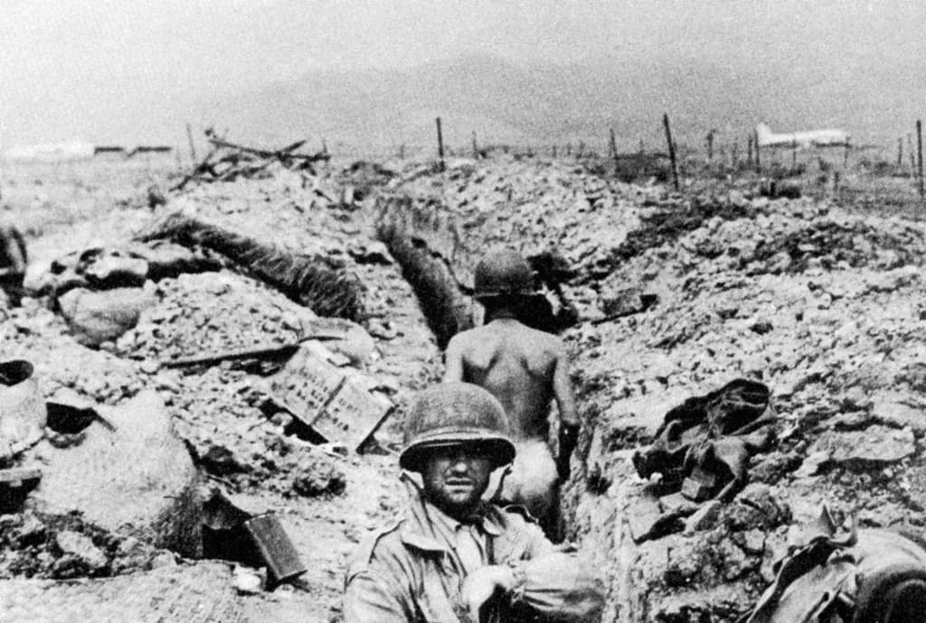 With the Vietminh shelling them from the hazy hills in the distance, the French troops tried to survive in their trenches.